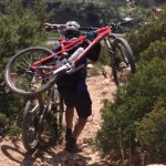 Cycling in the Atlas Mountains in Morocco. At one point Afulay decides to carry both of our bikes down a particular rocky and steep section